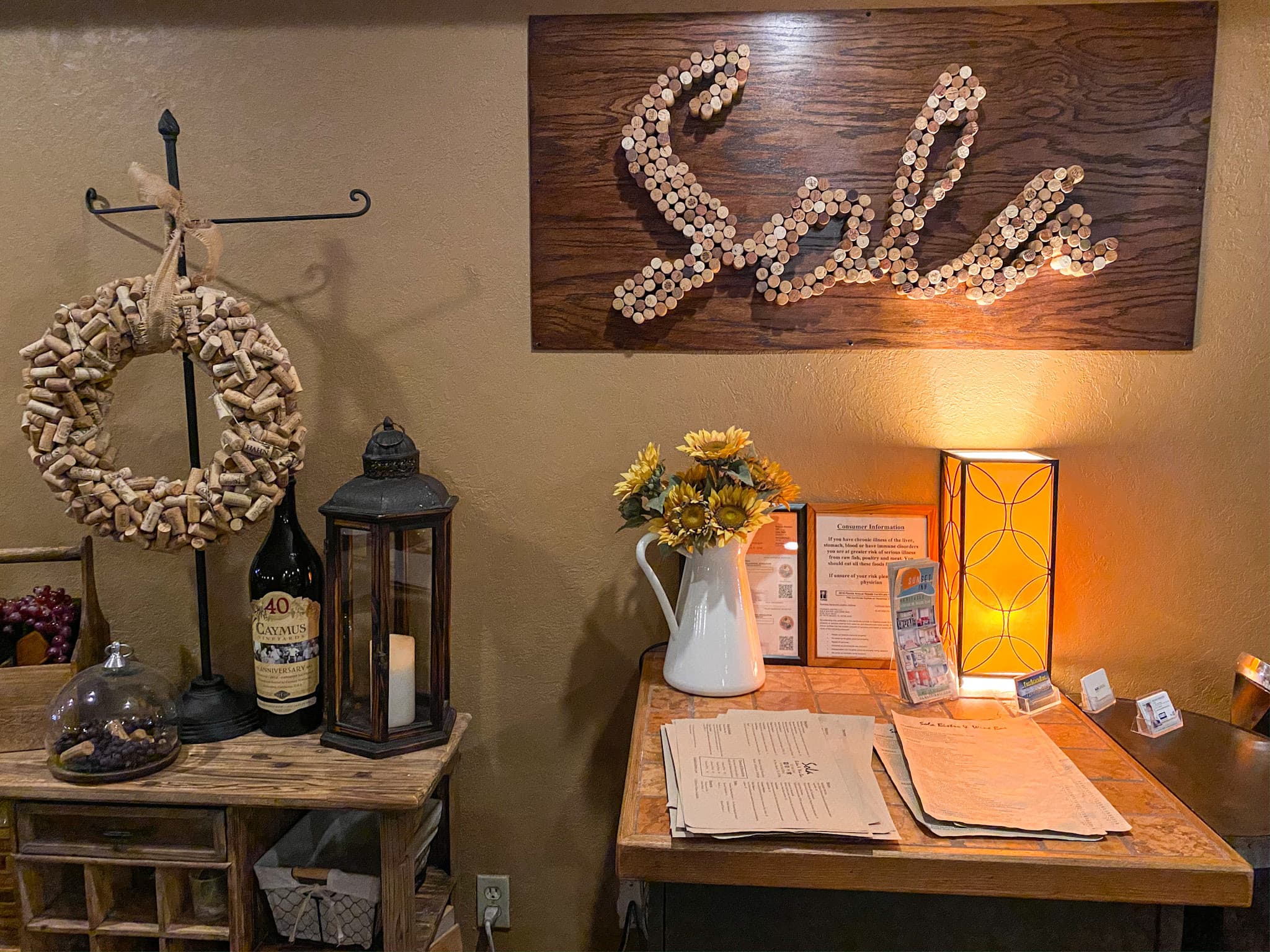 Sola Bistro & Wine Bar — cozy interior with cork sign